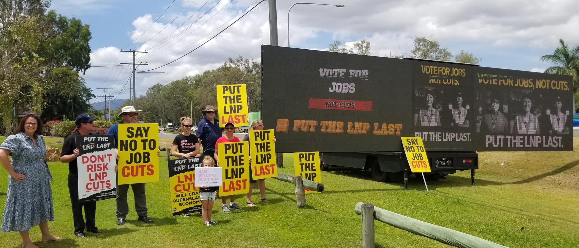 CAMPAIGN MESSAGE: Queensland Council of Unions President Kate Ruttiman and union supporters, unveiled a massive digital billboard in Rockhampton today.