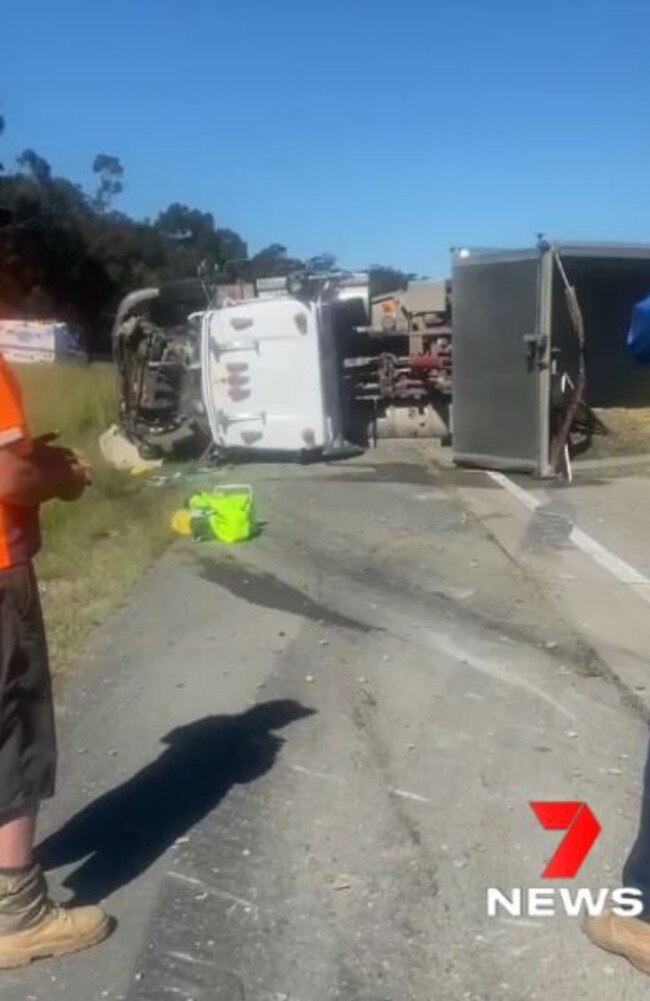 The truck which rolled near Exit 49 in Pimpama. Picture: 7 News Gold Coast.