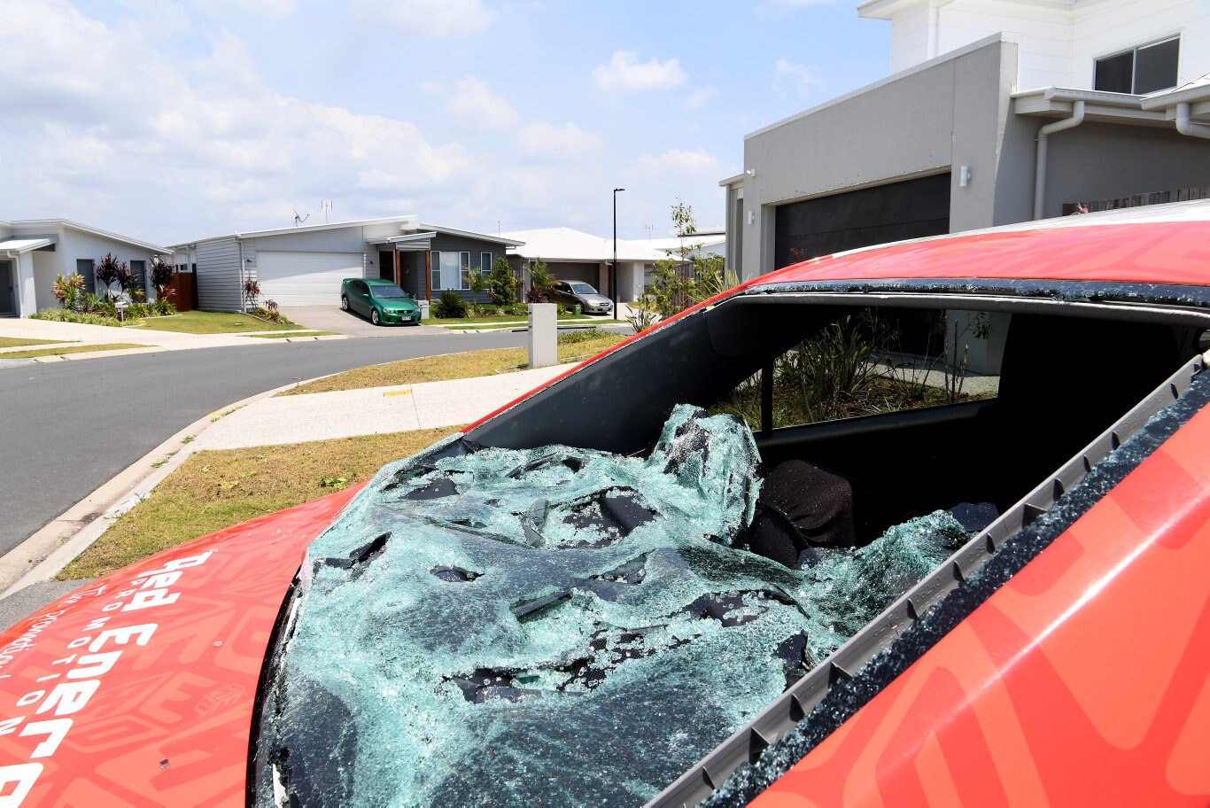 Cleaning up after the Sunday storm on the Sunshine Coast Coast.Hail damage in Aura Estate