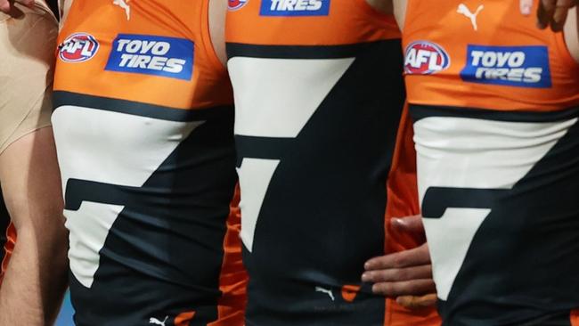 SYDNEY, AUSTRALIA - SEPTEMBER 14:  The Giants line up for the welcome to country and national anthem ceremony during the AFL First Semi Final match between GWS Giants and Brisbane Lions at ENGIE Stadium, on September 14, 2024, in Sydney, Australia. (Photo by Matt King/AFL Photos/via Getty Images)