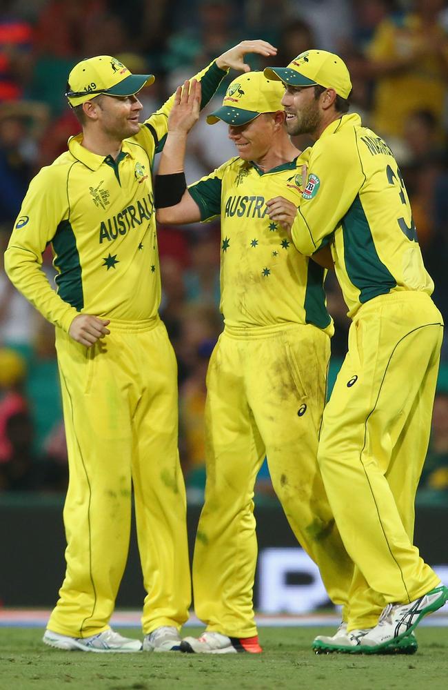 Michael Clarke and Glenn Maxwell celebrate with Xavier Doherty after the spinner took a catch against Sri Lanka.