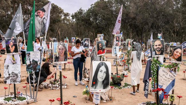 People visit a memorial for the victims killed at or kidnapped from the Supernova music festival. Picture: Menahem Kahana/AFP