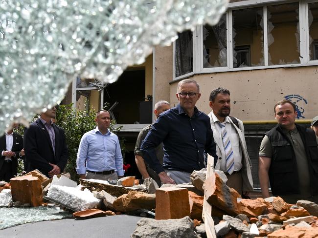 Australian Prime Minister Anthony Albanese tours damaged residential areas in Irpin on the outskirts of Kyiv, Ukraine, Sunday, July 3, 2022. Mr Albanese made a 12 hours long visit to Kyiv meeting with Ukrainian President Volodymyr Zelenskiy. (AAP Image/Lukas Coch) NO ARCHIVING