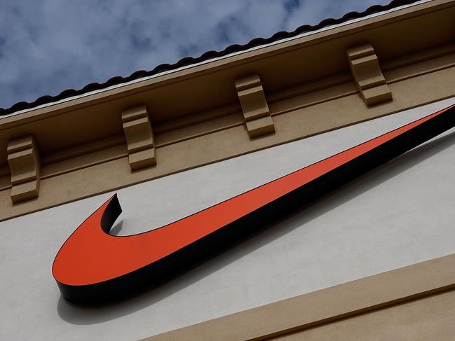 ORLANDO, FL - DECEMBER 12:  The  "Swoosh" logo is seen on a Nike factory store on December 12, 2009 in Orlando, Florida. Tiger Woods announced that he will take an indefinite break from professional golf to concentrate on repairing family relations after admitting to infidelity in his marriage. The company issued a statement that "Woods and his family have Nike's full support." (Photo by Getty Images)