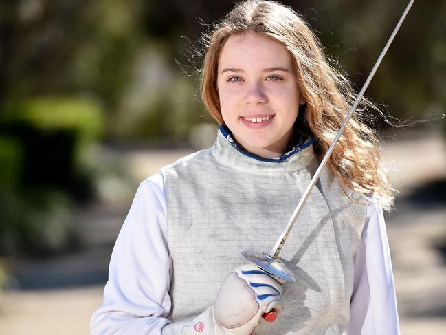 Champion fencer Hana Chorley, 14, poses during a photo shoot at Ryde on Sunday August 19th. Hana Chorley has made an extremely successful transition from diving to fencing, ranking top five in the state after less than a year. (AAP IMAGE / Troy Snook)