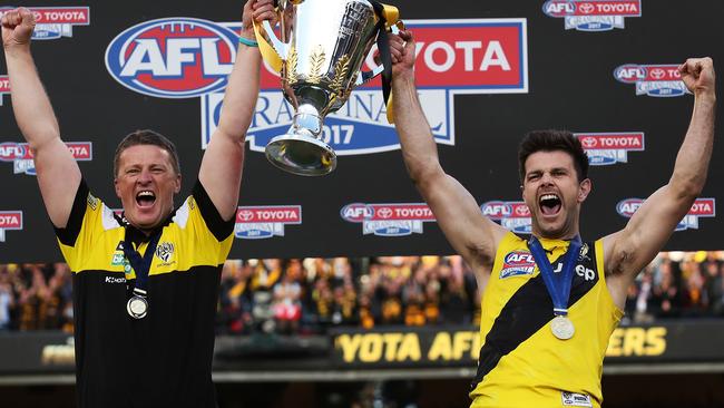 Richmond coach Damien Hardwick and captain Trent Cotchin celebrate lifting the 2017 AFL premiership cup. Picture. Phil Hillyard