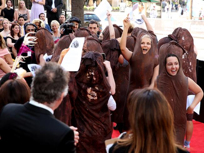 The protesters dressed in sausages, stormed onto the red carpet. Picture: Richard Dobson