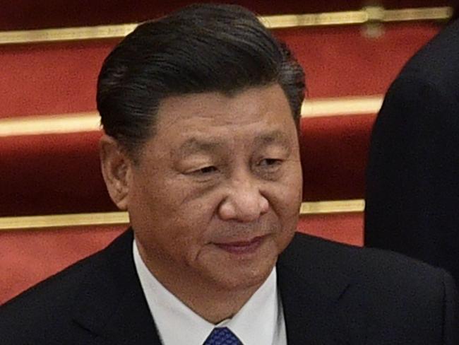 Chinese President Xi Jinping (L) and  Premier Li Keqiang arrive for the the closing session of the National People's Congress at the Great Hall of the People in Beijing on May 28, 2020. (Photo by NICOLAS ASFOURI / AFP)