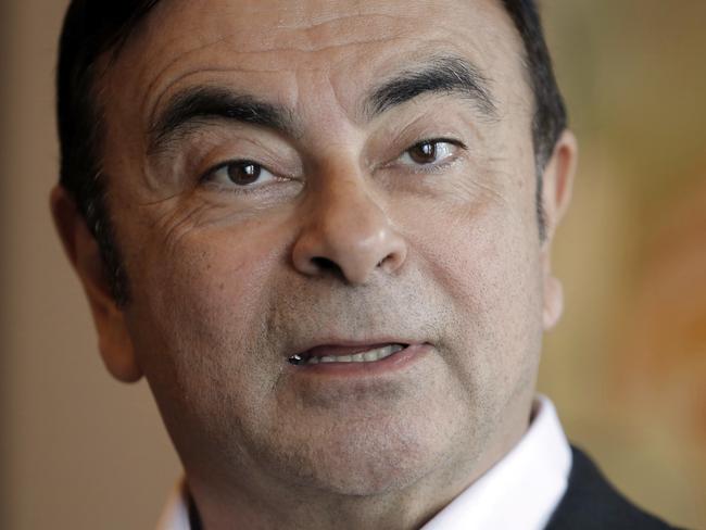 In this Friday, April 20, 2018 photo, Nissan Chairman Carlos Ghosn speaks during an interview in Hong Kong. Ghosn, who became one of the auto industry's most powerful executives by engineering a turnaround at the Japanese manufacturer, was arrested Monday and will be fired for allegedly underreporting his income and misusing company funds, the automaker said. (AP Photo/Kin Cheung)