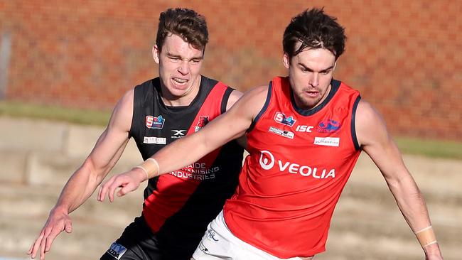 Lewis Johnston goes up against Riley Thilthorpe in the SANFL. Picture: Sarah Reed