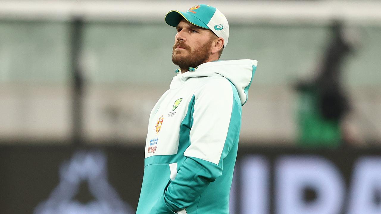 MELBOURNE, AUSTRALIA - OCTOBER 28: Matthew Wade of Australia speaks with Aaron Finch as rain delays play the ICC Men's T20 World Cup match between England and Australia at Melbourne Cricket Ground on October 28, 2022 in Melbourne, Australia. (Photo by Robert Cianflone/Getty Images)