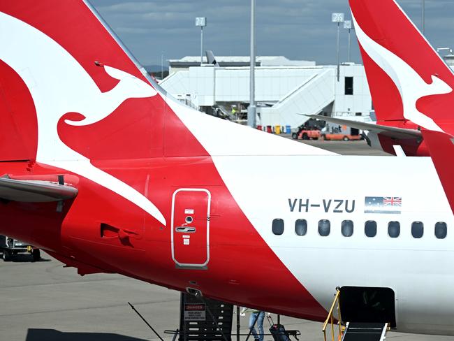 BRISBANE, AUSTRALIA - NewsWire Photos - AUGUST 11, 2022. Qantas baggage handlers at work at Brisbane airport. Industrial action will start at Qantas and budget offshoot Jetstar by the end of August amid an escalating fight over pay with its licensed engineers.Picture: NCA NewsWire / Dan Peled