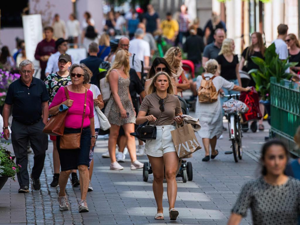 Crowds of people walk in Stockholm, where social distancing and lockdown measures are recommended but not mandated. Picture: Jonathan Nackstrand/AFP