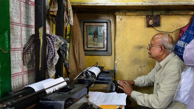 Typist working on an old typewriter in Kolkata.