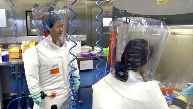 WUHAN, CHINA - FEBRUARY 23 2017: Virologist Shi Zheng-li, left, works with her colleague in the P4 lab of Wuhan Institute of Virology (WIV) in Wuhan in central China's Hubei province Thursday, Feb. 23, 2017.- PHOTOGRAPH BY Feature China / Barcroft Studios / Future Publishing (Photo credit should read Feature China/Barcroft Media via Getty Images)