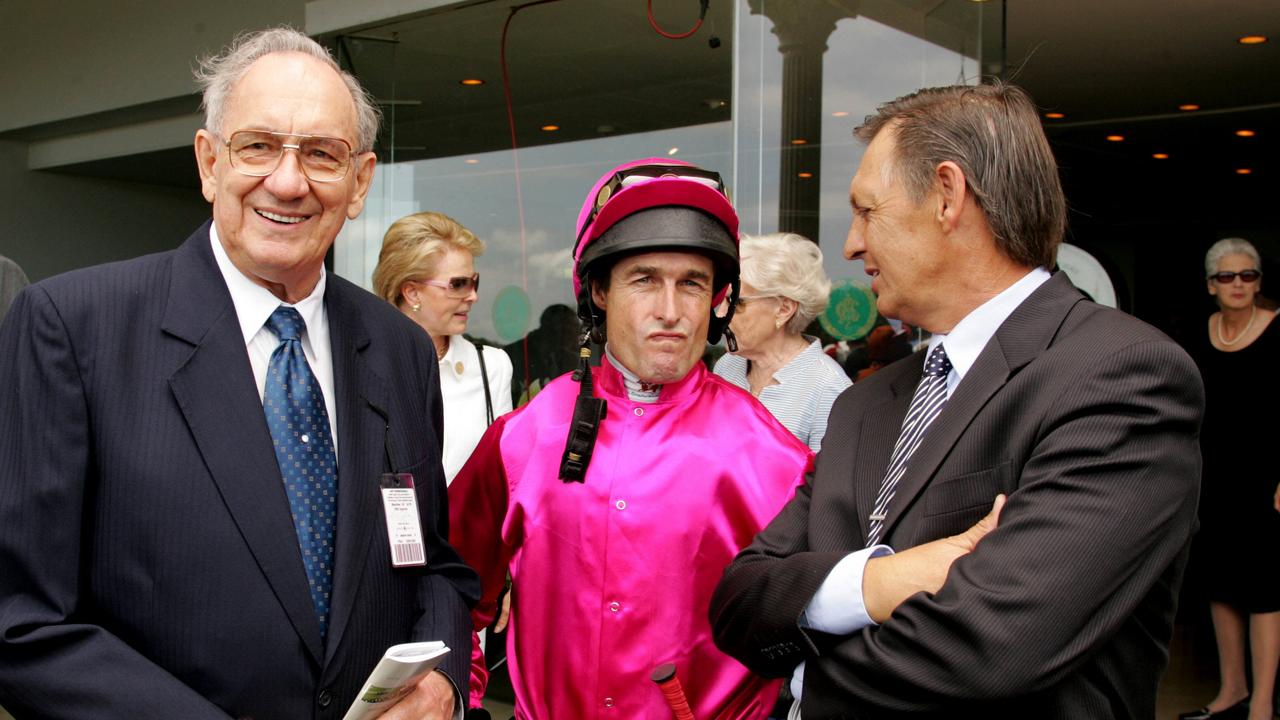 Businessman racehorse owner Bob Ingham with jockey Darren Beadman and trainer John Hawkes at Randwick 07 Oct 2005.