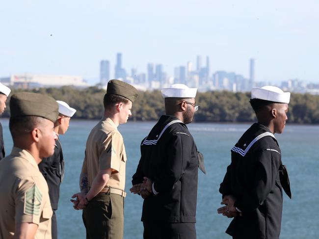 US Marines and Navy sailors “manning the rails” (in the tan uniforms) as the USS America arrived in Brisbane on Tuesday. Picture: Liam Kidston