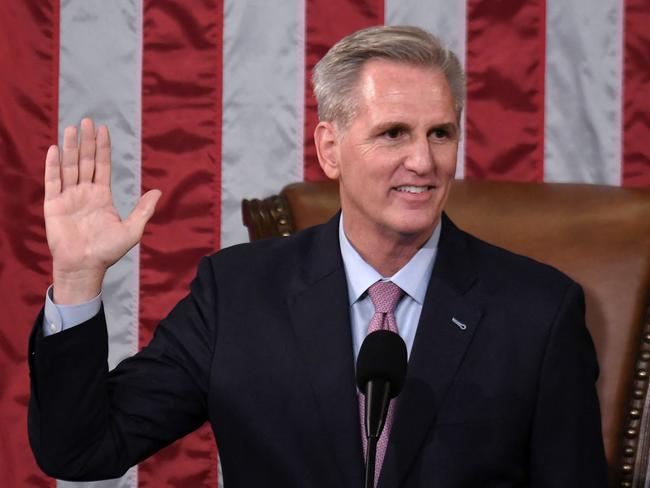 TOPSHOT - Newly elected Speaker of the US House of Representatives Kevin McCarthy takes the oath of office after he was elected on the 15th ballot at the US Capitol in Washington, DC, on January 7, 2023. - Kevin McCarthy's election to his dream job of speaker of the US House of Representatives was secured through a mix of bombproof ambition, a talent for cutting deals and a proven track record of getting Republicans what they need. He only won election as speaker after they forced him to endure 15 rounds of voting -- a torrid spectacle unseen in the US Capitol since 1859. (Photo by OLIVIER DOULIERY / AFP)