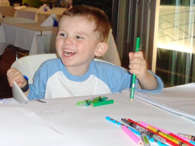 A happy William colouring in. Pic: AAP Image/NSW Police.