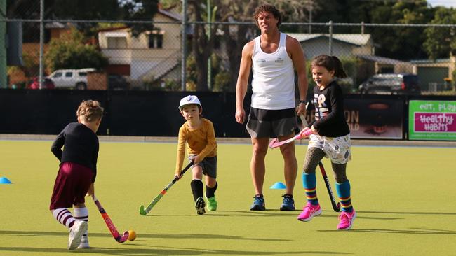 Grafton hockey legend Brent Livermore joined juniors during a school holiday hockey clinic at the Grafton fields on Thursday. Photo: Suellen Jenkins