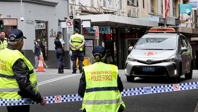 Police at the scene where a taxi hit a woman at the corner of Goulburn and Sussex Street in the Sydney CBD. Picture: Damian Shaw