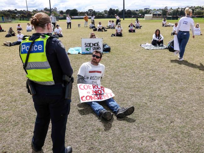 Police approach the protesters. Picture: Ian Currie