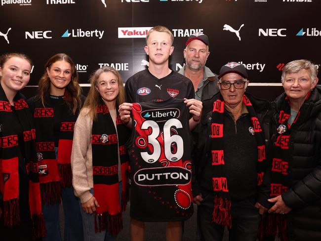 Angus Clarke with his family after being presented with his Essendon jumper. Picture: James Wiltshire/AFL Photos