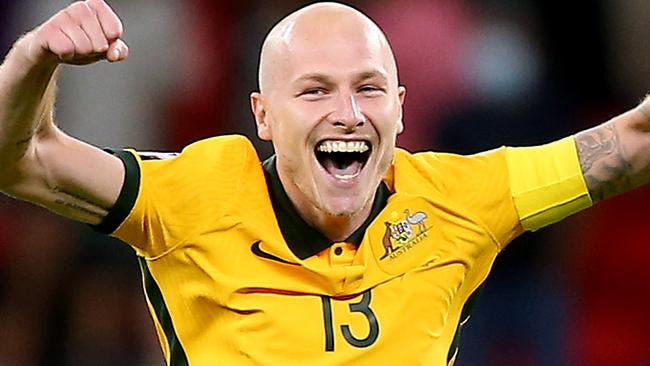 DOHA, QATAR - JUNE 13: Aaron Mooy of Australia celebrates their sides victory after a penalty shoot out following the 2022 FIFA World Cup Playoff match between Australia Socceroos and Peru at Ahmad Bin Ali Stadium on June 13, 2022 in Doha, Qatar. (Photo by Mohamed Farag/Getty Images)