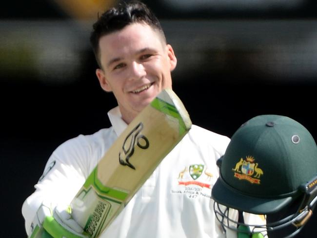 BRISBANE, AUSTRALIA - DECEMBER 16: Peter Handscomb of Australia celebrates scoring a century during day two of the First Test match between Australia and Pakistan at The Gabba on December 16, 2016 in Brisbane, Australia. (Photo by Bradley Kanaris/Getty Images)