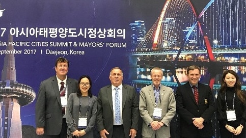 Blacktown Mayor and MP Stephen Bali (second from right) with general manager Kerry Robinson (third from right) and community events manager Peter Filmer (far left) in South Korea in 2017.