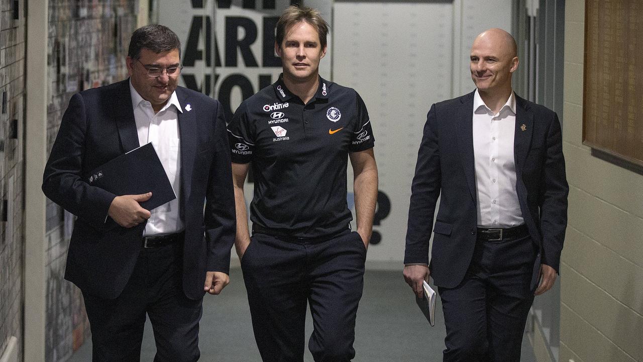 David Teague announced as Carlton's new coach. Teague walks into todays press conference with President Mark LoGiudice and CEO Cain Liddle . Pic: Michael Klein