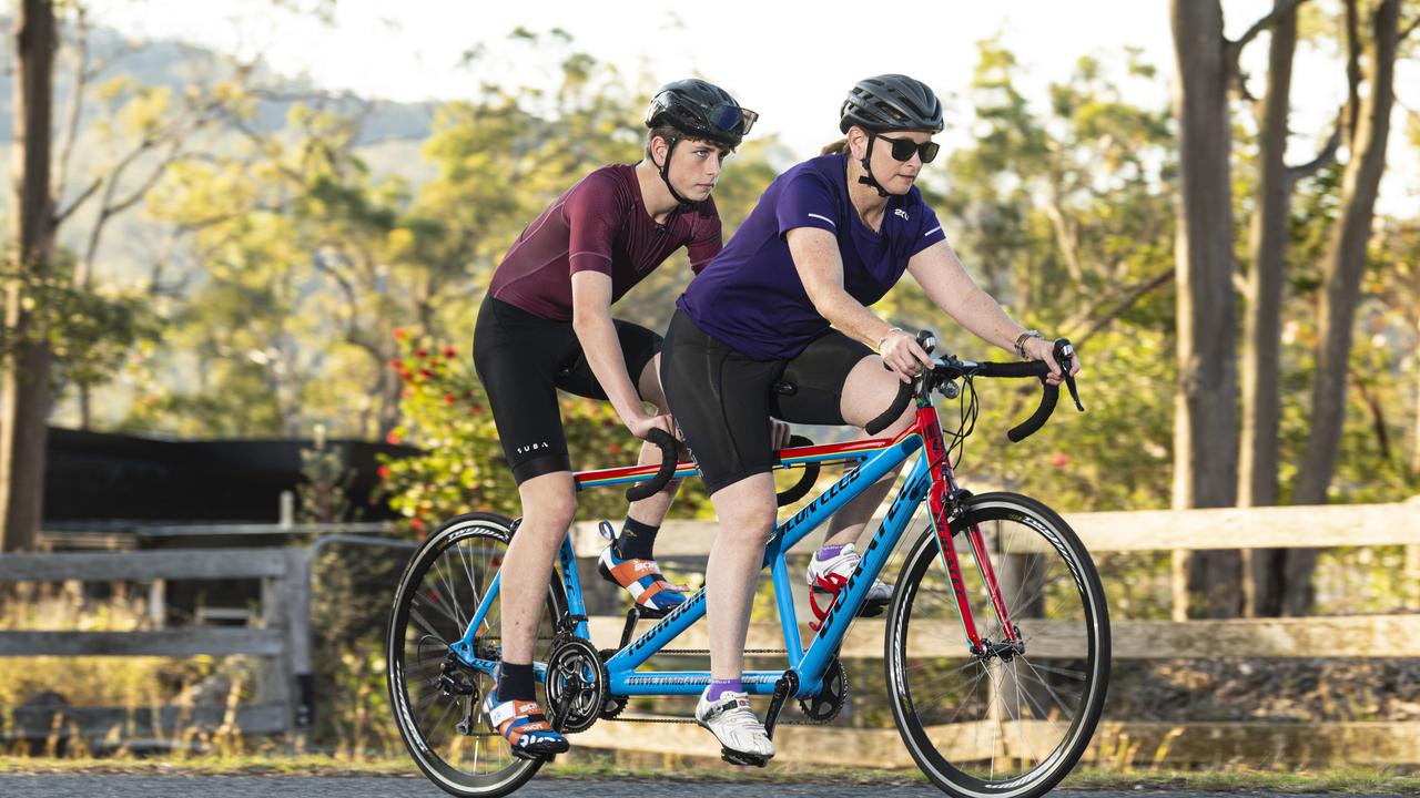 Fifteen-year-old Mitchell Wilkes, pictured training with mum Lisa Wilkes, has a degenerative eye condition and competes in tandem triathlon, Thursday, October 17, 2024. Picture: Kevin Farmer