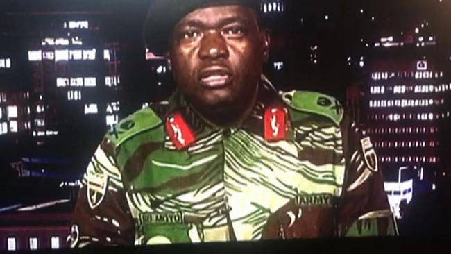 This screen grab from a television broadcast on the Zimbabwe Broadcasting corporation (ZBC) shows Zimbabwe Major General Sibusiso Moyo reading a statement.