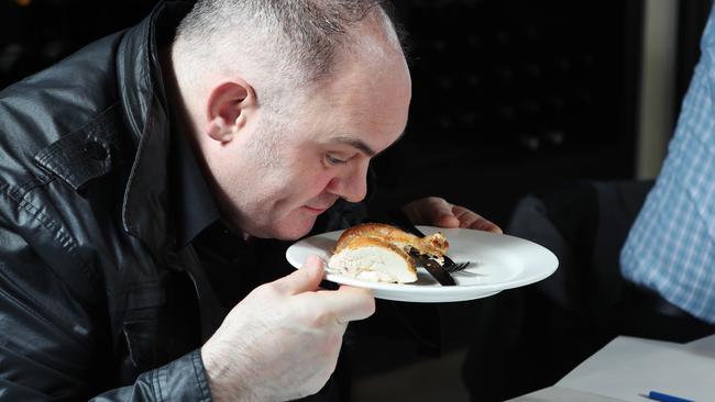 Chef Paul Wilson assesses the aroma of one of the samples.