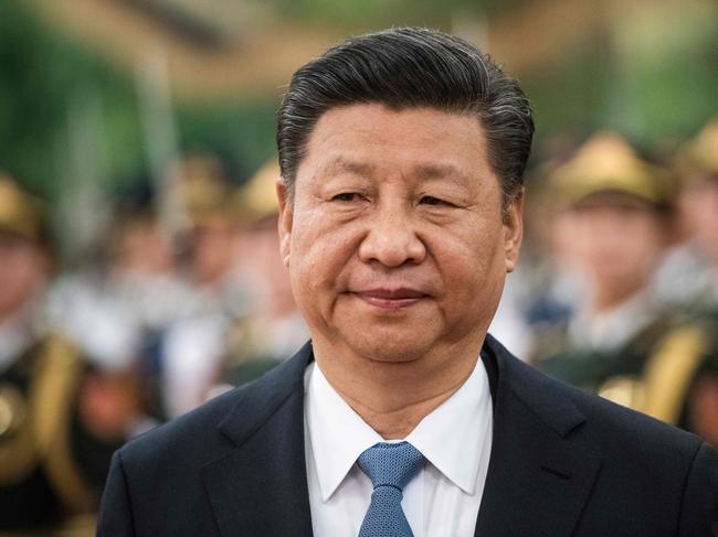 China's President Xi Jinping reviews a military honour guard during a welcome ceremony at the Great Hall of the People in Beijing on December 12, 2018. (Photo by FRED DUFOUR / AFP)