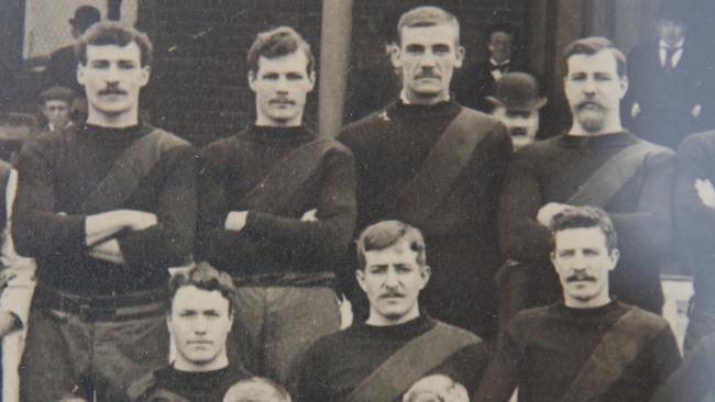 Forward Charlie Moore (second from left, top row) lines up with Essendon’s 1897 squad.