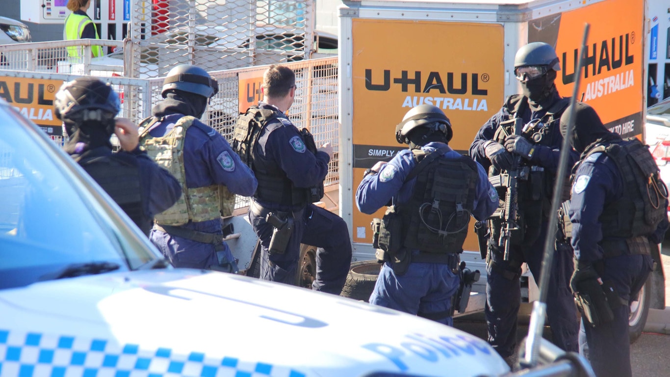 Heavily armed tactical police were involved in this morning's police operation at Sapphire Beach. Picture: Frank Redward