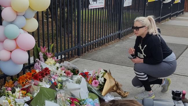 Greenacre resident Lauren Danilo pays her respects following the tragic car accident.