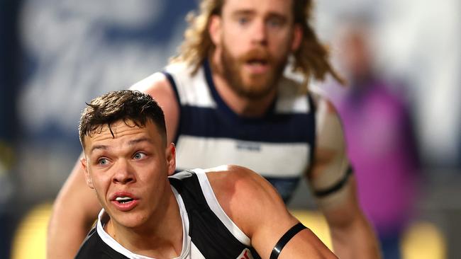 Marcus Windhager was also tasked with restricting Geelong star Cam Guthrie (background). Picture: Getty Images