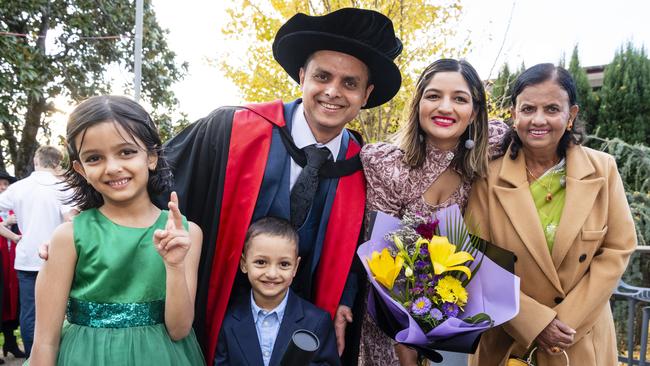 Doctor of Philosophy graduate Avishek Khanal with daughter Avika Khanal, son Amish Khanal, wife Kritika Dhakal and mum Bimala Khanal at a UniSQ graduation ceremony at Empire Theatres, Wednesday, June 28, 2023. Picture: Kevin Farmer