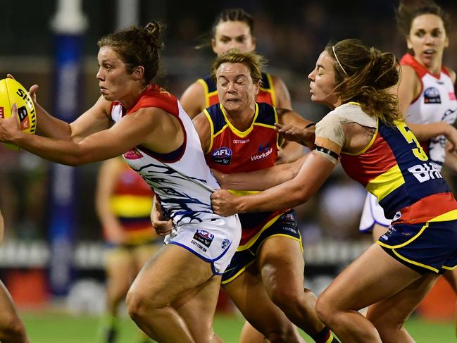 Crow Jenna McCormick (right, wearing headband) tackles Ellie Blackburn of the Western Bulldogs during Adelaide’s round one, one-point loss. Picture: AAP Image/Mark Brake