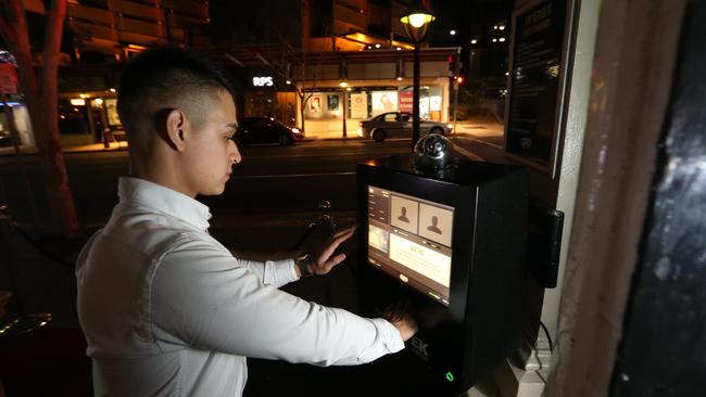 Camilo Martinez operates an ID scanner at the GPO in Fortitude Valley. Picture: Richard Waugh