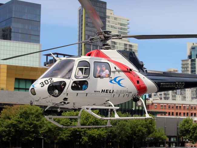 Jockey Michelle Payne attending the Crown Oaks Ladies Lunch after yesterday's historic Melbourne Cup win, then being whisked away by helicopter to the Kyneton Cup.  Michelle taking off for the trip. Picture: Alex Coppel