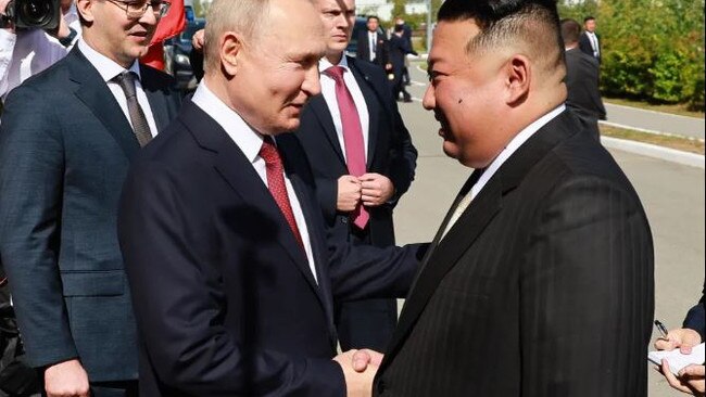 Vladimir Putin and Kim Jong-un shake hands as they meet in Tsiolkovsky. Picture: Supplied