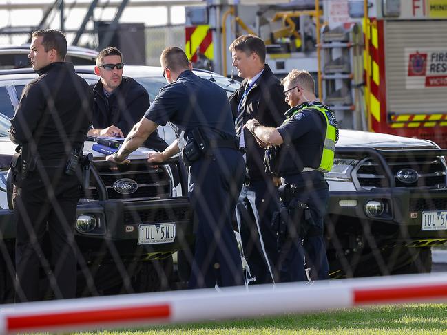 Detectives at the scene. Picture: Ian Currie