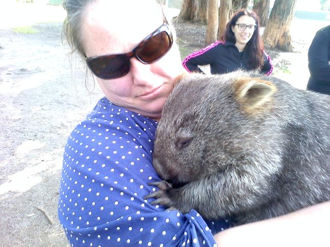 Sam Adamson, Iron Pot Bay Vineyard chef, with a furry friend.