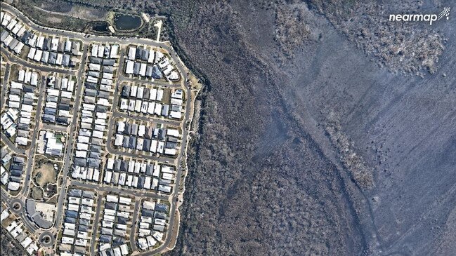 This September 16 photograph again shows how close the bushfire came to destroying homes before being turned away by desperate fire fighters.