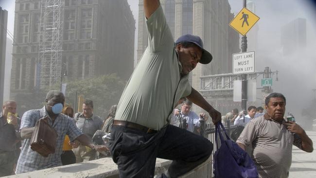 People running from a collapsing tower in New York on September 11. Picture: AFP