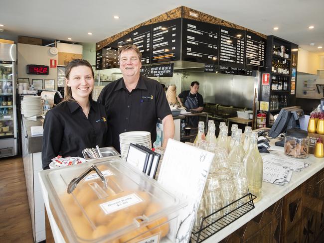 Fish Frenzy manager Garry Shepherd and staff member Molly Hulton. The restaurant now carries Chinese language signage because of the upturn in Chinese tourism. Picture: RICHARD JUPE