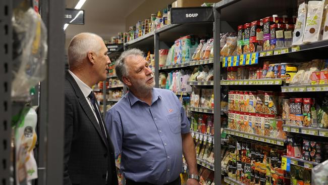 Minister for Energy and Renewables Nick Duigan and Lindisfarne IGA owner Brett Mackay in Lindisfarne IGA on Tuesday, October 29, 2024.